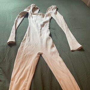 Used , wore one time only Fashion Nova jumpsuit, size xsmall, beige